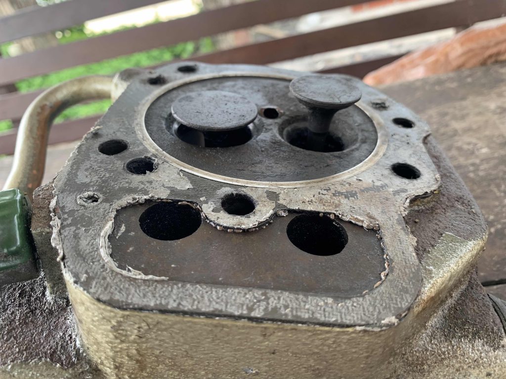 Learning more on Piston! This is the part he is fixing now at the piston, one for air to go in the other out. The hole around them worn out so air is able to escape.