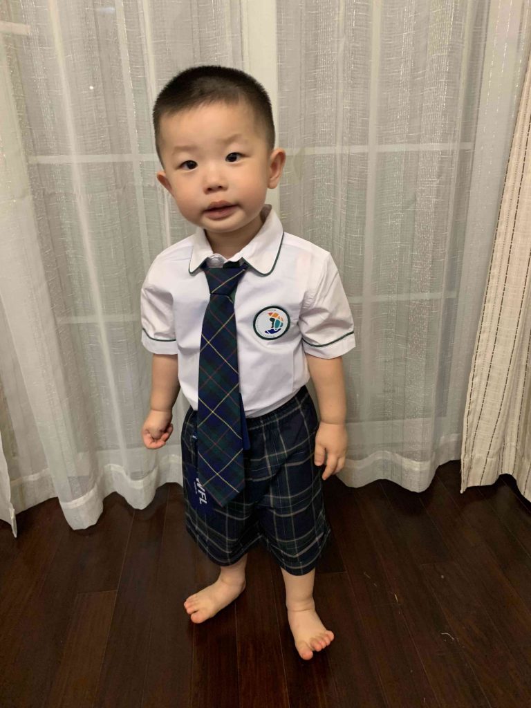 Lucas testing his school uniform, World Foreign Language Kindergarten...