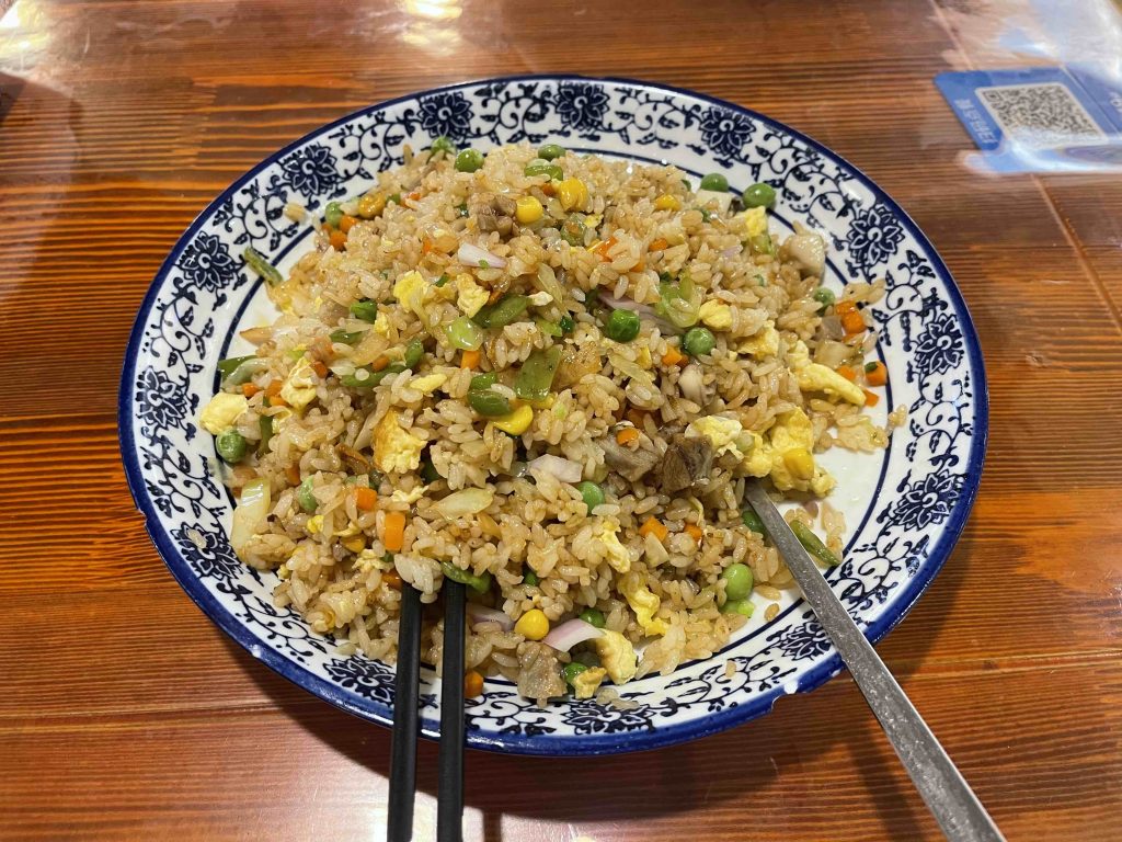 Lunch is a big plate of lamb fried rice! Too oily...