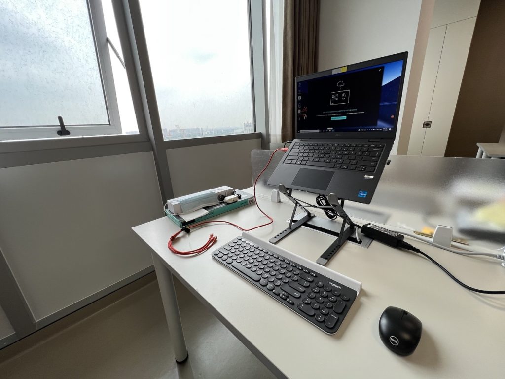 Nice setup with the logitech keyboard K780 and a high laptop stand.