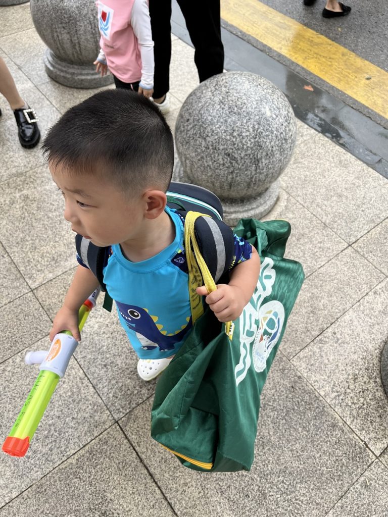 Learning to carry his own stuff...