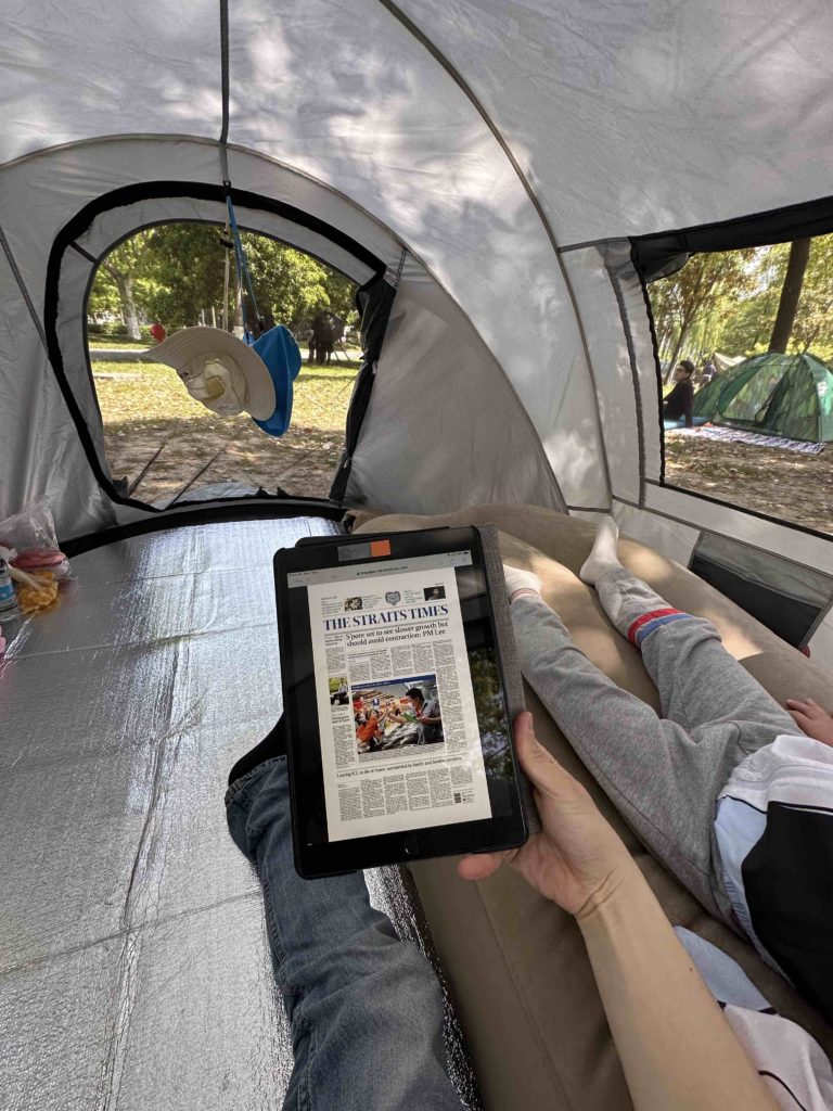 Reading papers in the tent!