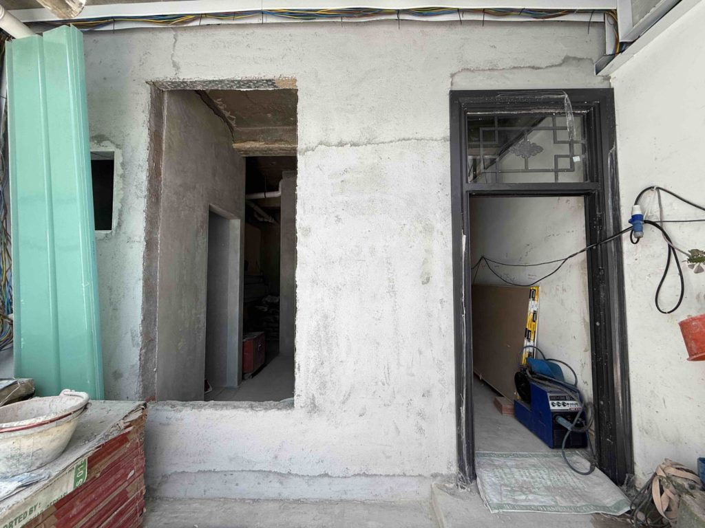 Main door is up! I like the panel above the door that allows light into the house!