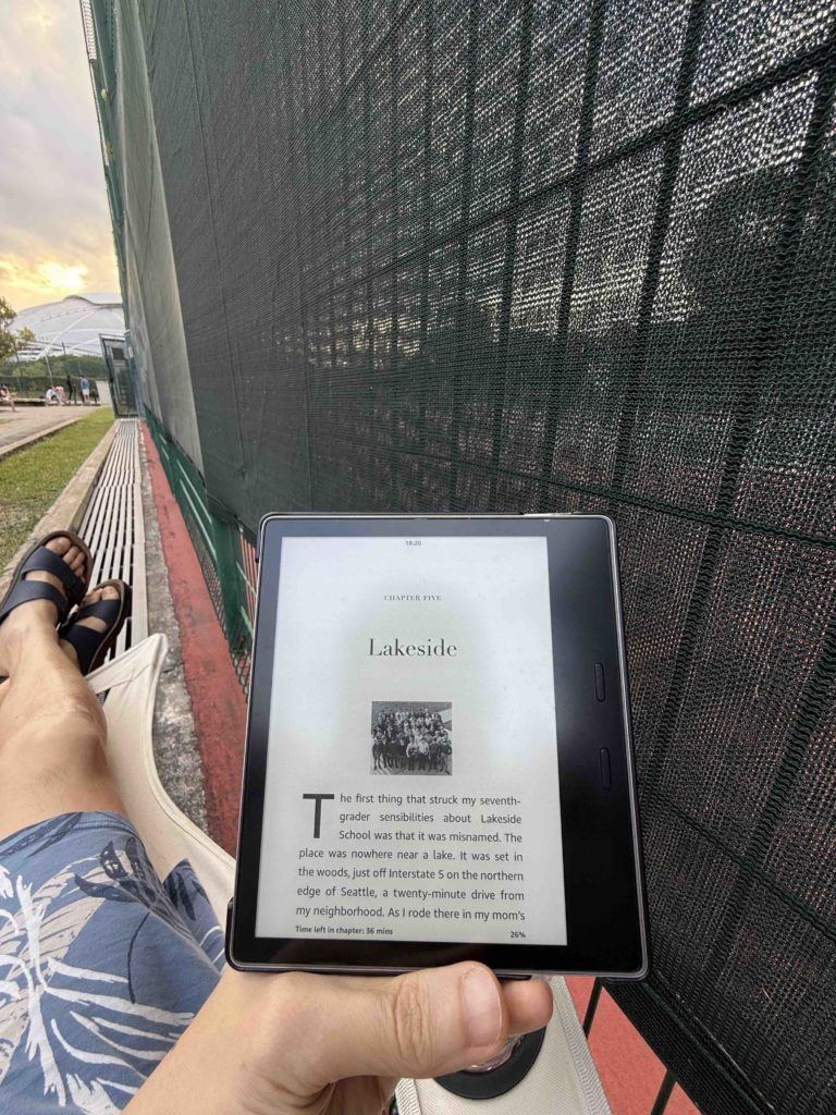 Reading while kid is having tennis training...