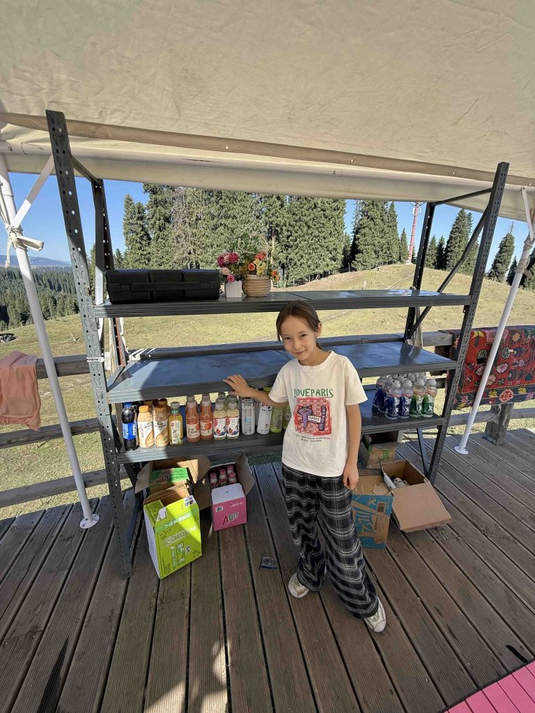 Saw a pretty 10 year old girl running the stall in the mountains!