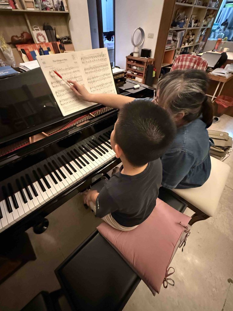 L1 intensive piano training. Also his first time on the baby grand piano!